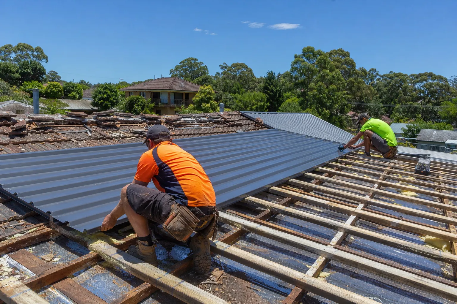 Colorbond metal roof being installed on a Central Coast home to replace an old tile roof