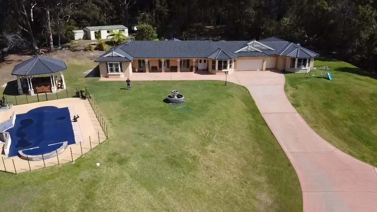 Acreage home on the Central Coast with its concrete tile roof restored in charcoal