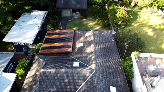 Aerial view of a faded grey concrete tile roof in Pearl Beach before restoration