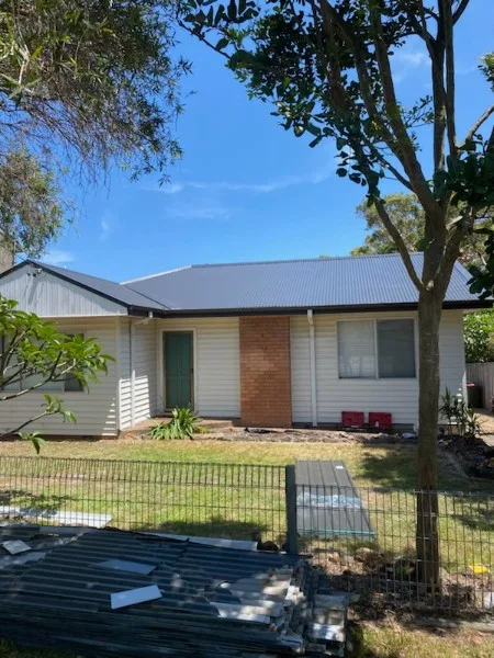 New Colorbond metal roof on a single-storey Central Coast home — Roof Restorations & Replacements Central Coast