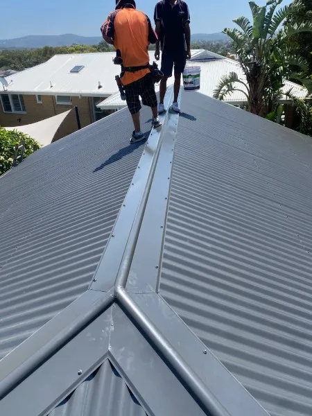 Our roofers installing a new metal roof on the Central Coast — Roof Restorations & Replacements Central Coast